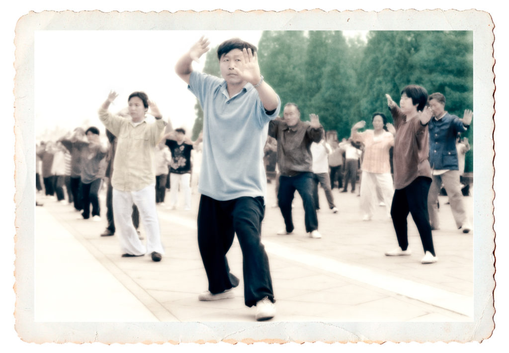 Hand-tinted photo of early morning Tai Chi exercises in China